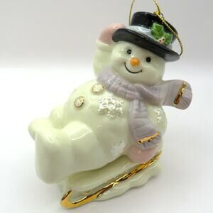 Porcelain Snowman Sledding Ornament Christmas Holiday Figurine 4.5" Tall
